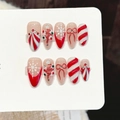 Set de uñas postizas de Navidad con lazos de bastón de caramelo rojos y blancos y copos - Extra Pequeño (XS) / Rojo y Blanco Almendra Media (3340)