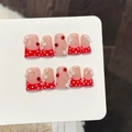 Handmade press-on nails with red French tips, white polka dots and 3D floral accents - Extra Small (XS)