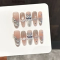 Pink cat eye press-on nails with 3D lion dance charms and pearls on white display card - XS / 3448-Long Oval