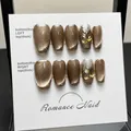 Handmade champagne cat-eye press-on nails with sparkling silver glitter and rhinestones - XS / Dark Brown Cat Eye Gem Short Coffin