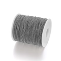 Macro shot of silver O-link metal chain on white spool for DIY jewelry making - 2mm x 5m / White K