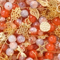 DIY jewelry set featuring orange and purple crackle beads with gold Lucky metal charms - Orange-Red (Gold Accessories)