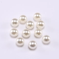 Macro shot of 10 smooth round cream-white ABS loose imitation pearls for jewelry DIY - 6mm / Off White
