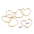 Detailed view of 22mm x 19mm heart-shaped copper bezel frames for DIY resin jewelry - 30Pcs Pack / KC Gold Heart