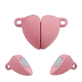 Macro view of pink heart-shaped magnetic clasp with dual connectors for jewelry DIY - 5 Pieces / Pink