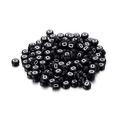 Macro shot of circular black acrylic beads featuring white letter D for DIY jewelry - Black Round White Letter D / 100pcs Pack