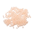 Vista macro de cuentas de vidrio melocotón perlado de 3mm para creación de joyas - Rosa Naranja Claro