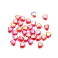 Macro shot of 9mm heart-shaped acrylic beads with colorful AB gradient coating for DIY crafts - Red