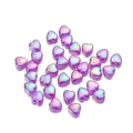 Macro shot of purple iridescent acrylic heart beads for DIY jewelry making and crafts - Purple