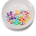 Colorful iridescent acrylic heart beads for DIY jewelry making displayed in a white plate - Multicolor