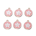 Close-up of six gold-plated cherry blossom pendants with pink enamel for DIY jewelry - White Border White Sakura
