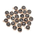 Detail view of 26 alphabet charms with gold metal finish and black enamel for DIY jewelry - Black