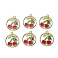 Detailed macro view of gold-tone cherry alloy pendants with red enamel and hanging loops - Cherry