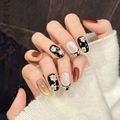 Unghie finte fatte a mano con arte floreale nera, effetto cat-eye e foglie d'oro - XS / Ovale Corto