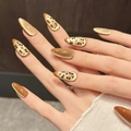 Golden brown cat eye press-on nails with leopard heart patterns in long oval shape - Medium Almond Style / XS