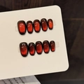 Handmade press-on nails featuring dark red glitter cat-eye effect in short square oval shape - Extra Small (XS) / Short Oval
