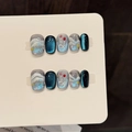Set di unghie finte artigianali con effetto cat-eye blu oceano e sfumature stellate - XS