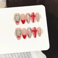 Faux ongles amande de Noël avec nœuds rouges et paillettes vertes sur fond neutre - Très Petit (XS) / Rouge Nude Amande Moyenne (2050)