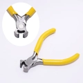 Macro detail of precision end cutters with carbon steel blades and yellow handles - End Cutting Pliers