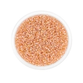 Macro shot of 2mm light orange iridescent glass seed beads in a round storage box - 1800 pcs/Pack (2mm) / Camel