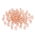 Vista macro de cuentas de cristal facetado champán para joyería y artesanía DIY - Rosa Loto Transparente