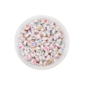 Close-up of assorted colorful alphabet beads in a round storage box for DIY jewelry - Round Cream White Multicolor English Alphabet / 100pcs Pack