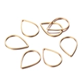 Macro view of six gold-plated teardrop-shaped brass frames for DIY jewelry making - 21x15mm (30 Pieces/Pack) / KC Gold