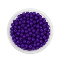 Top view of smooth purple 6mm acrylic spacer beads for DIY jewelry making in a tray - Deep purple