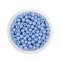 Macro shot of 6mm light blue acrylic round spacer beads for DIY jewelry making and crafts - Sky Blue