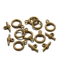 Détail macro de fermoirs à bascule en bronze antique pour création de bijoux DIY - Lot de 20 / Bronze Antique