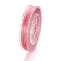 Gros plan du fil élastique rose pour perles sur bobine pour création de bijoux DIY - 50m Par Bobine / Rose