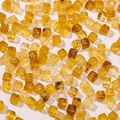 Macro view of translucent amber acrylic sugar cube beads with inner marble texture - 20 Pieces Set / Amber