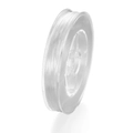 Close-up of clear elastic crystal string on a spool for DIY jewelry and beading - White