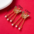 Detail of vintage butterfly tassel earrings with colorful enamel and pearl drops - Blue Purple Pink Butterfly Tassel