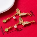 Detailed view of traditional gold butterfly pendant with pink enamel and pearl drop - Butterfly Green Leaf Flower