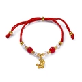 Detail of red braided New Year bracelet featuring a golden pig charm and pearls - 1 Piece / Red Fortune Horse with Red Glass Beads