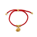 Detailed view of red woven lucky bracelet with a golden rocking horse charm and beads - 1 Piece / Gold Rocking Horse with Gold Beads