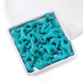 Detail of giraffe-shaped turquoise loose beads with realistic brown patterns and dimensions - Giraffe Shape / 19.5*21mm (approx. 31 pcs/strand)