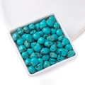 Close-up of 10x8.5mm turquoise skull beads with vintage crackle finish for DIY jewelry - 8.5*10mm (approx. 38 pcs/strand)