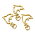 Detailed view of three golden dolphin-shaped metal lobster clasps for DIY keychains - Dolphin / 5 Pieces / Gold