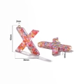 Macro view of X-shaped resin letter pendant with pink sequins and dimensions - Letter X