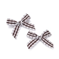 Detailed view of striped fabric bows with scalloped edges for DIY hair accessories - Brown