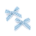 Close-up of two blue and white striped fabric bows with scalloped edges for DIY hair accessories - Lake Blue