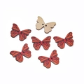Macro detail of butterfly shaped wooden sewing buttons with red and orange wing patterns - Butterfly