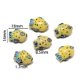 Macro shot of 18mm yellow handmade ceramic fish beads for jewelry with 1.7mm hole size - Fat Yellow Fish