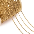 Detail of gold-plated stainless steel curb chain links on a spool for DIY jewelry making - Gold Side Pressed Two Pieces