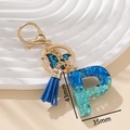 Portachiavi lettera P in resina blu con paillettes, farfalla e nappa in camoscio - Blu P