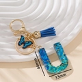 Portachiavi lettera U con paillettes cuore blu, nappina e ciondolo a farfalla - Blu U