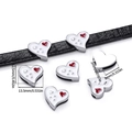 Macro shot of heart-shaped enamel charm on leather strap showing detailed dimensions - White Heart