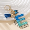 Portachiavi con lettera E in resina con farfalla blu e nappina per borsa - Blu E